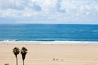 Horizontal aerial view of Santa Monica beach, as seen from the cliffs at Palisades Park, with view of vast expanse of sand, Los Angeles, California, U...