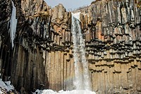 Well-known waterfall in iceland over a basaltic columnar system.