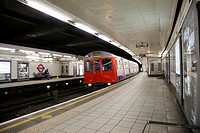 Monument Underground station platform with train pulling in, London, England, United Kingdom, Europe.
