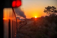 Sunset in the Royal Livingstone Express luxury train. The Steam Locomotive, 156 is a 10th Class originally belonging to the Zambezi Sawmills Limited. ...