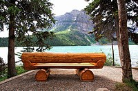 Bench made out of tree trunks near Lake Louise in Rocky Mountains, Canada.
