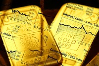 Business concept with gold bars overlaid with stock market illustration.