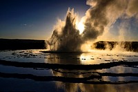 Great Fountain Geyser erupting at sunset.