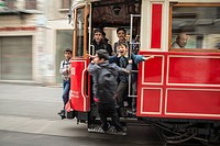 Kids playing on a tram in Istiklal Caddesi, Beyoglu, Istanbul, Turkey,.
