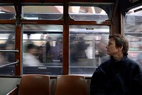 Hong Kong, China, Asia. European woman travelling in tram on Hong Kong Island.