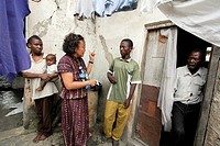 KENYA. American Catholic missionary visiting poor people with HIV AIDS, Mombasa.