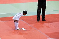 A kid bows in a Judo competition, San Jose, California, USA