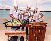 Asian catering chefs at the beach cooking with a Koththu station. Gold Coast, Queensland, Australia.