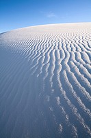 Wind has eroded the gypsum sand in these scene to create interesting patterns and textures in White Sands National Monument on a bright sunny day, nea...