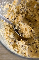 Chocolate chip cookie dough in a mixing bowl.