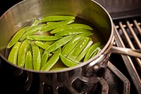 peas in pot of water.