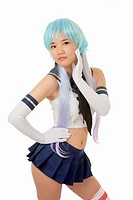 Beautiful and sexy Chinese woman having some fun with cosplay isolated an a white background.