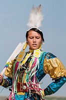 Female dancer in jingle dance regalia, Pow-wow, Blackfoot Crossing Historical Park, Alberta, Canada.