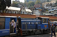 Tourists and locals board and depart The Darjeeling Himalayan Railway station. Known as the ""Toy Train"", it is a 2 ft (610 mm) narrow gauge railway ...