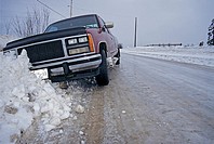 Pickup truck in ditch after sliding off icy road, Smithers, British Columbia.