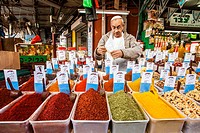 A vendor sells a large selection of Fresh ground spices in Tel Aviv´s Carmel Market.