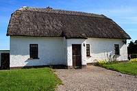 Traditional Old Irish Cottage with a thatched roof, Co. Galway, Ireland.