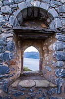 A window in the wall of Sotiros Monastery looking to Laconian Bay.