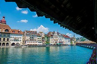 River Reuss with Chapel bridge and cityscape with blue sky and clouds in Lucerne, Switzerland.