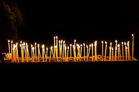 Candles in the cave church Panagia Kefalariotisa. Argolis, Peloponnese, Greece.