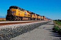 Picacho, AZ, USA - October 24, 2014: Approaching freight train loaded with cargo.
