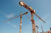 Construction cranes of the company Liebherr at a construction site in Memmingen, Bavaria, Germany
