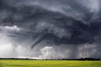 Tornado forms under long-lived supercell in northern Kansas, May 24, 2004. This supercell produced upwards of 15 tornadoes in just a few hours. It fre...