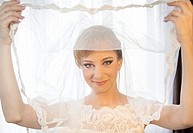 Beautiful young bride holding her veil - Bucharest, Romania, Eastern Europe, Europe.