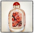 A gift bottle from China with an inlaid painting and name