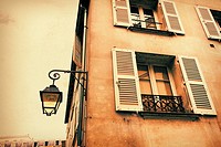 Old, Parisian historic house with an old street lamp in vintage style