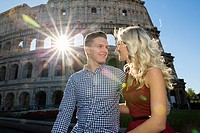 Couple at the Roman Colosseum in Rome Italy.