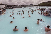 Bathers enjoy the healing thermal waters of The Blue Lagoon, Bláa lónið in Icelandic, outside Reykjavik, Iceland.