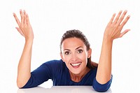 Happy brunette with hands gesturing excitement while looking at you in white background.