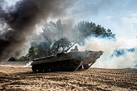 Cadets drive the BMP-1 infantry fighting vehicle during full-scale rehearsal of military maneuvers at proving ground of the 169th Training center of U...