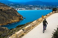 View of a cyclist in Albir area, Alicante province, Spain.