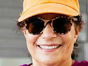 Senior woman in sunglasses and hat
