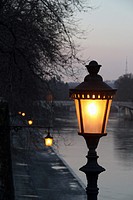 Street lamp on ponte sisto bridge by the tiber river in trastevere rome italy