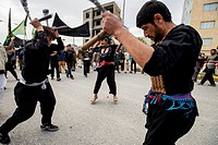 Shia Muslims flagellate themselves during street procession in the Day of Ashura, tenth day of Muharram and commemoration of Husayn ibn Ali´s death, M...