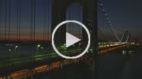 (Time-lapse) Morning rush hour traffic on the George Washington Bridge crosses the Hudson River between New Jersey and New York just before sunrise.