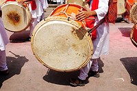 Playing musical instrument called 'dhol-taash' during Anant Chaturdashi Ganpati, Visarjan Miravnuk, Pune , Maharashtra , India.