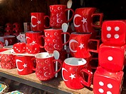 Turkish flag patterned red mugs and red dices on the rack of strret market at village Sirince, Selcuk, Izmir, Turkey, Europe.