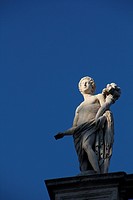 statue on top of the capitol hill building in Rome, Italy