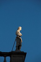 statue on top of the capitol hill building in Rome, Italy