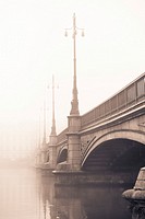 Empty bridge in heavy fog. Tranquil city scene with old architecture in Stockholm, Sweden.