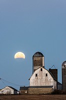 Lunar eclipse over farm buildings near Shakopee, Minnesota.
