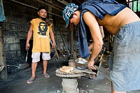 Blacksmiths at work in Puerto Princesa, Palawan, Philippines.