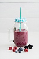 Healthy pink smoothie with berries and yogurt.