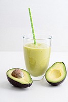 Healthy green smoothie with avocado in a glass.