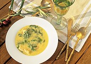 Avgolemono soup - typical Greek soup with chicken, spinach, eggs and lemon