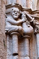 Musician and soldier carved on capital by master mason Reinard de Fonoll, East gallery of 14th century Gothic cloister, Cistercian monastery of Santes...
